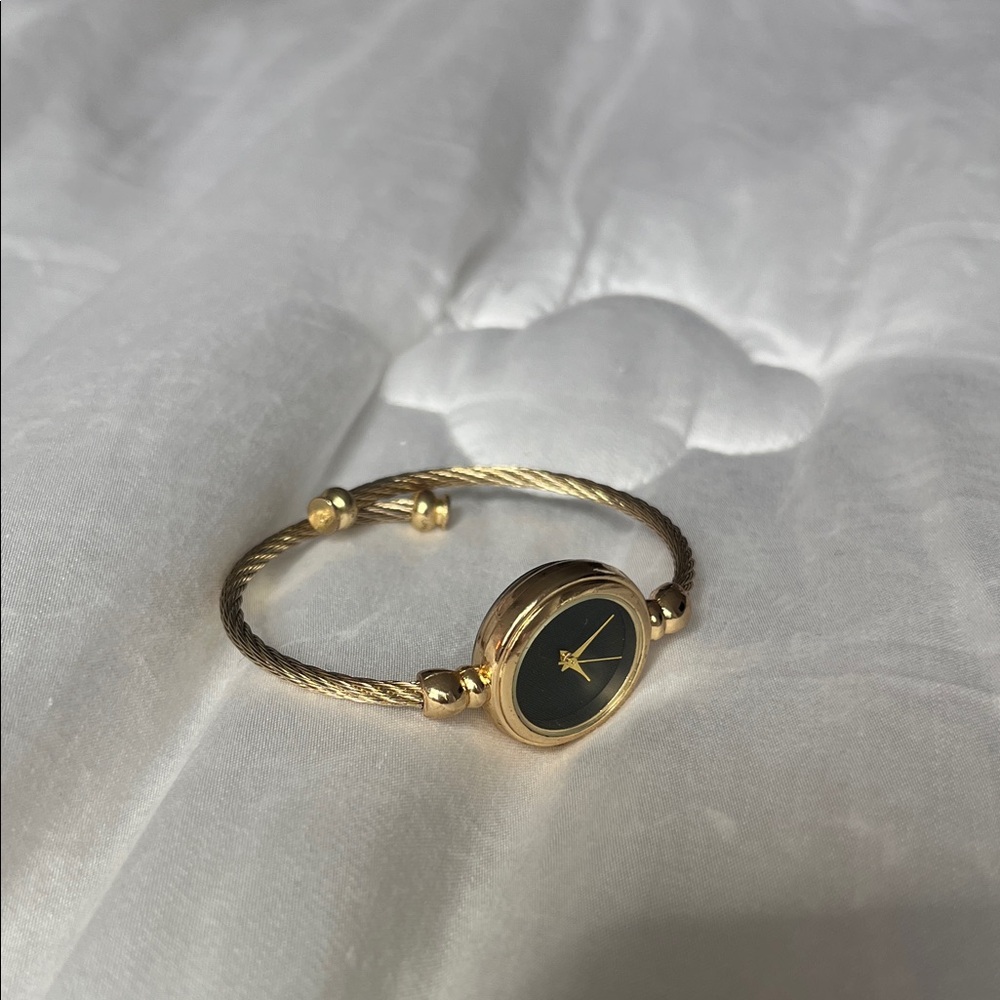 Elegant Gold and Black Vintage Watch